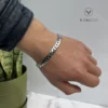 Radco stainless-steel bracelet displayed on a hand